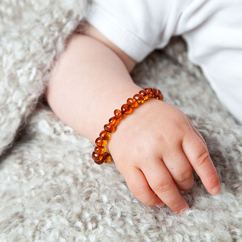 Baby barnsteen armband om